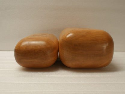 Two wooden blocks on a neutral background